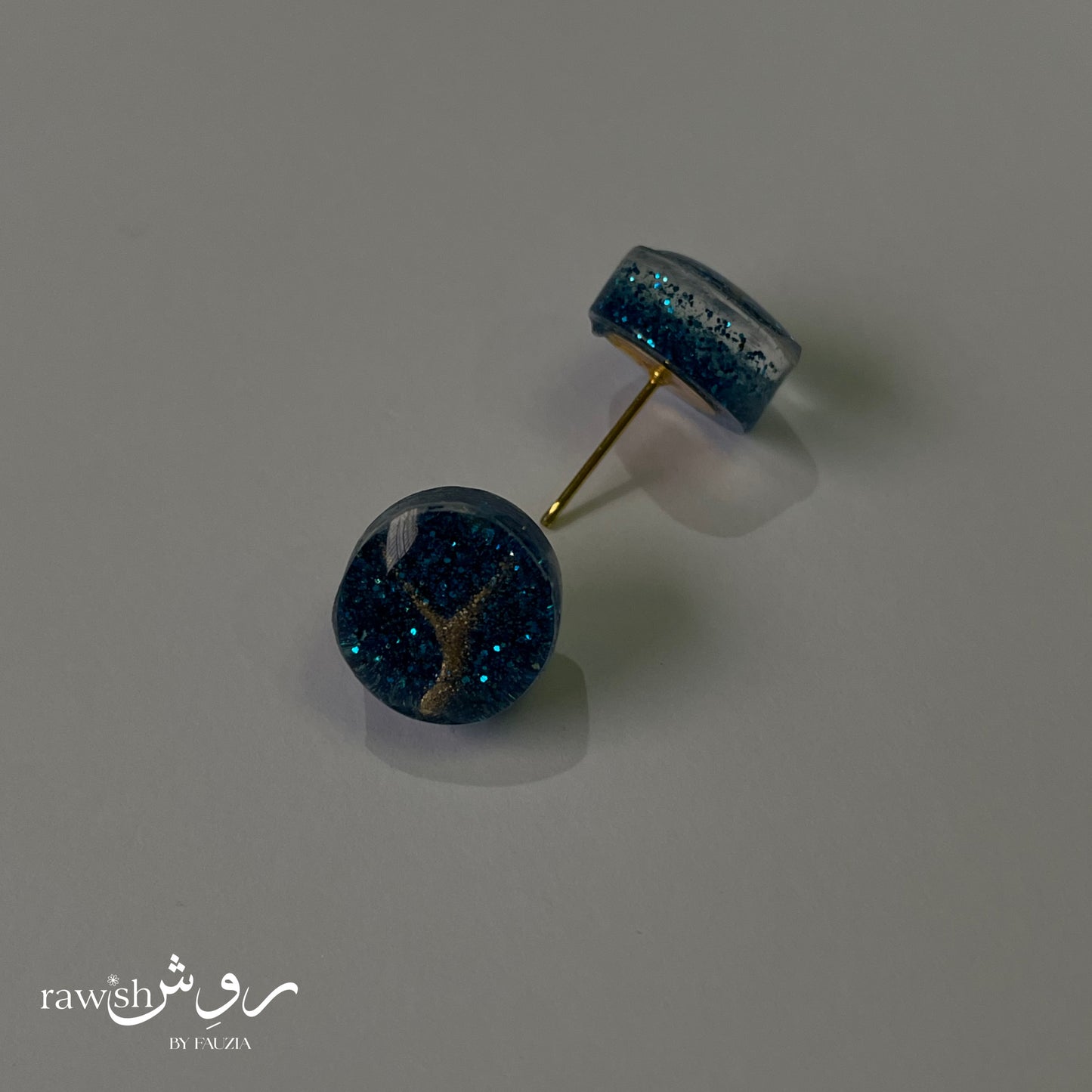 Shimmery blue round studs