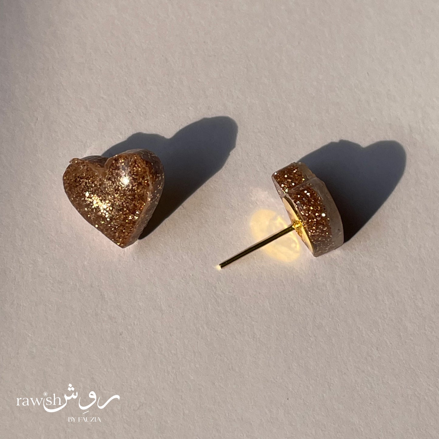 Golden glitter heart studs