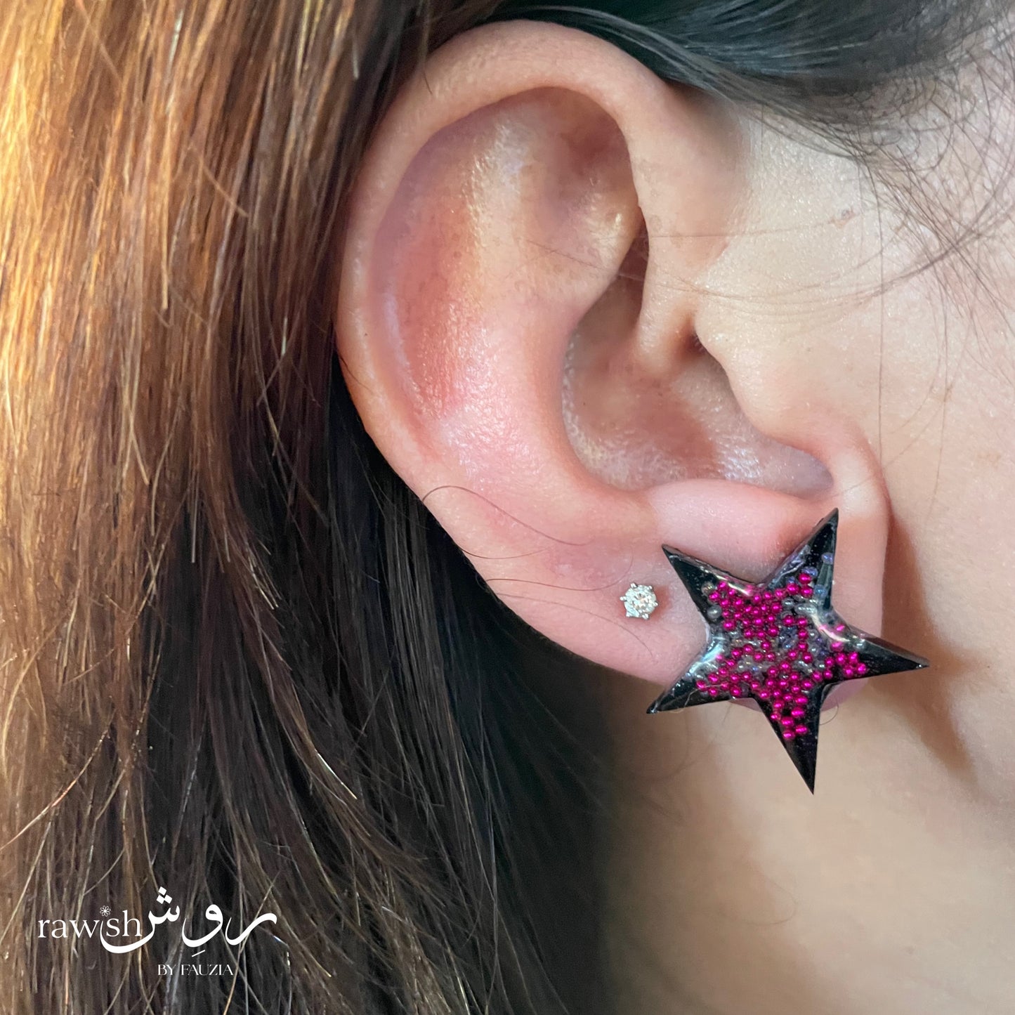 Black star studs with pink rhinestones