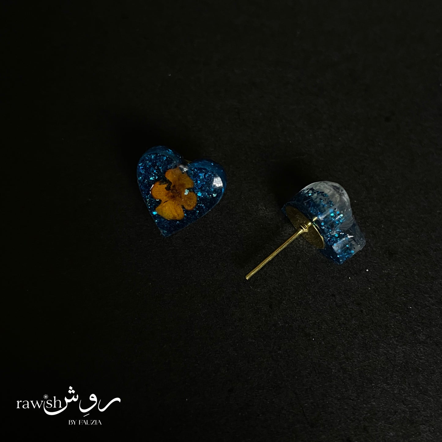 Shimmery blue floral heart studs