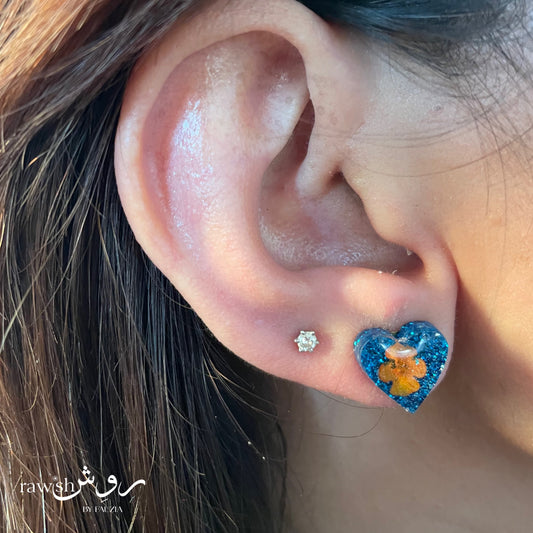 Shimmery blue floral heart studs