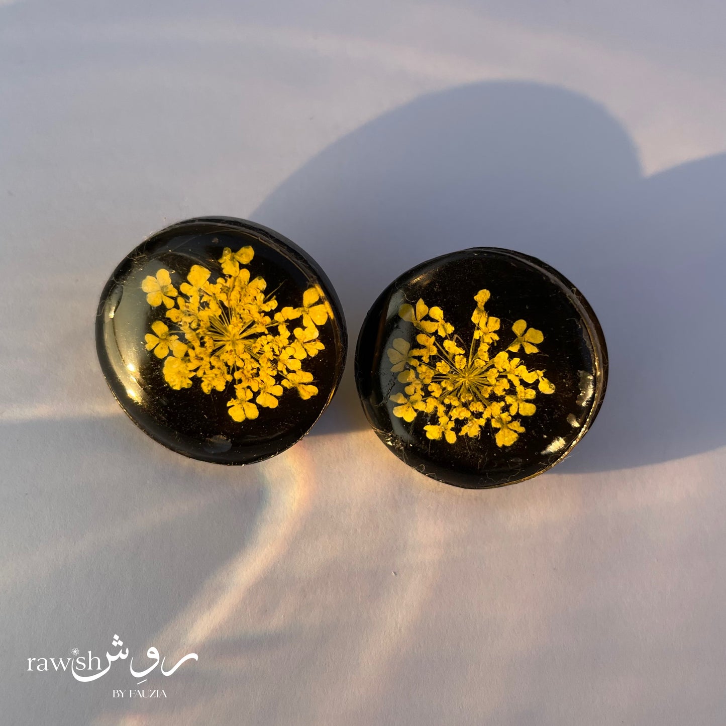 Black floral round earrings