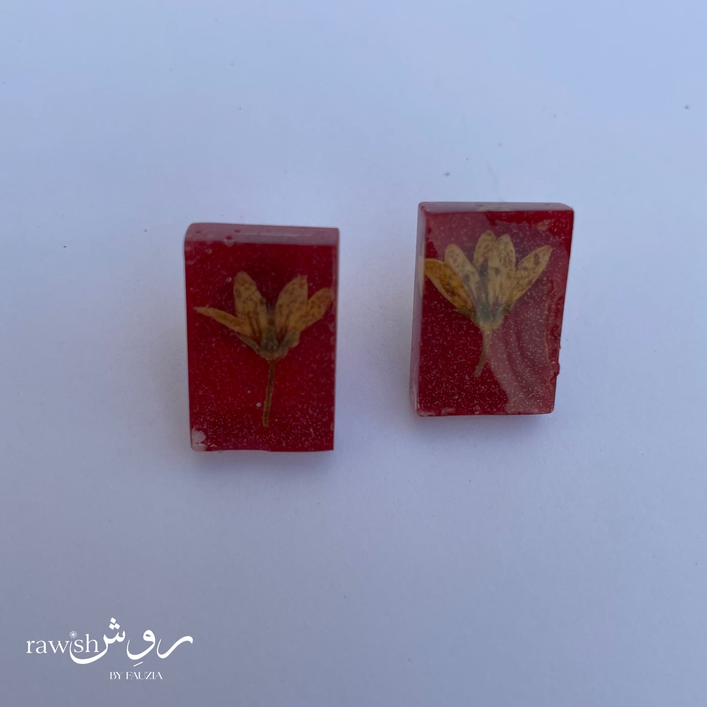 Red and yellow floral studs
