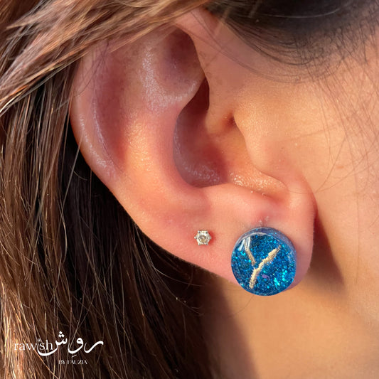 Shimmery blue round studs