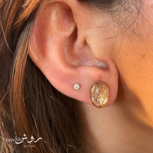 Golden glitter oval studs