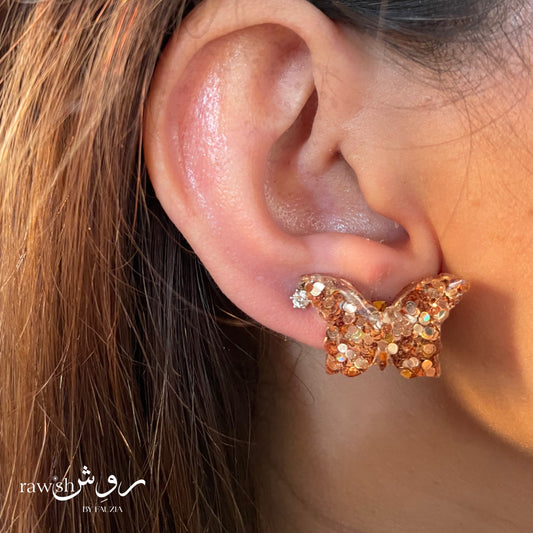 Golden glittery butterfly studs